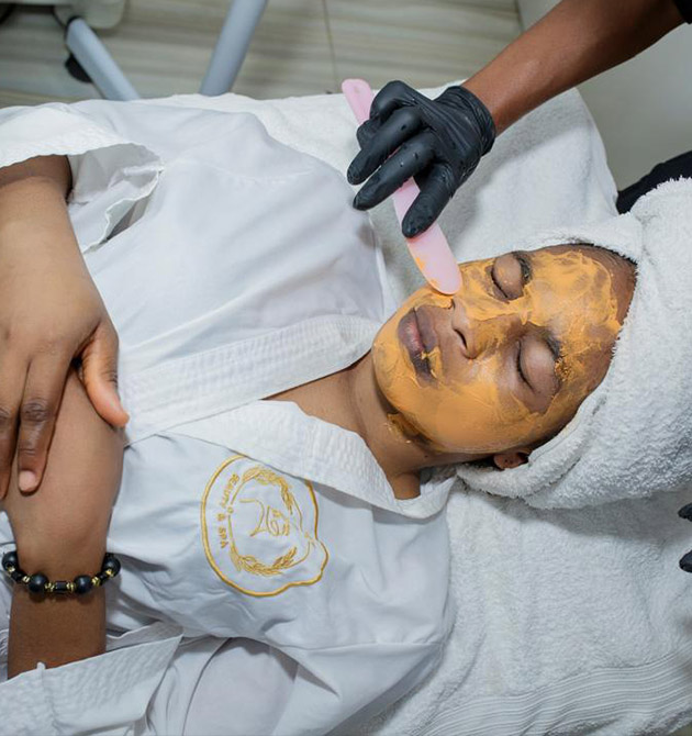 Portrait of smiling young woman bathing and taking care of her b